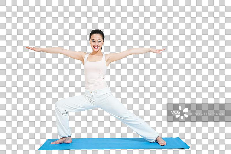 棚拍年轻女人做瑜伽图片素材