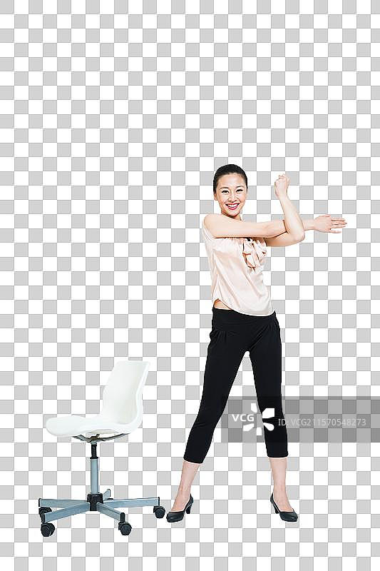 棚拍办公室年轻女人做运动图片素材