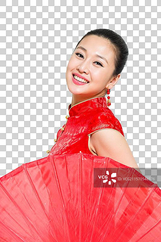 棚拍穿红色旗袍的年轻女人举着油布伞图片素材