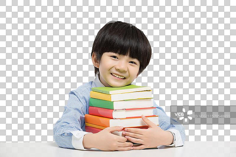 小男孩在书桌前玩耍图片素材