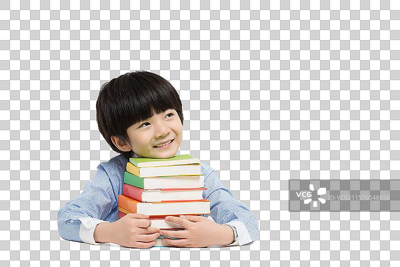 小男孩在书桌前玩耍图片素材