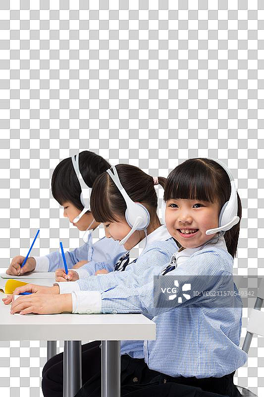 小学生们戴耳麦上课图片素材