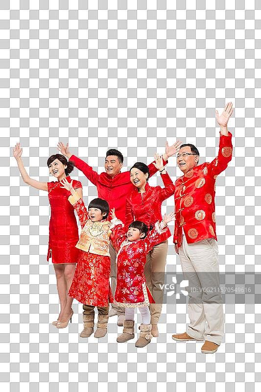 棚拍中国新年快乐的唐装家庭图片素材