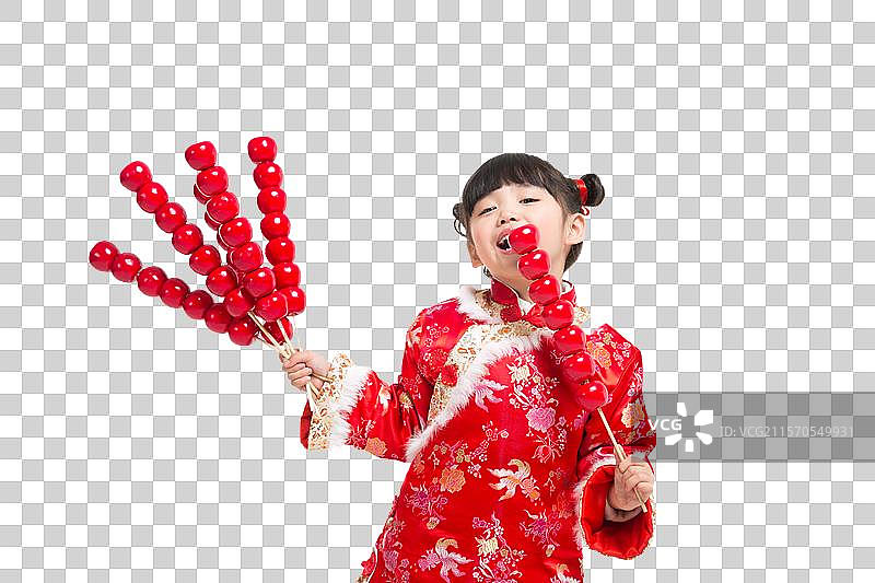 棚拍中国新年唐装儿童拿糖葫芦图片素材