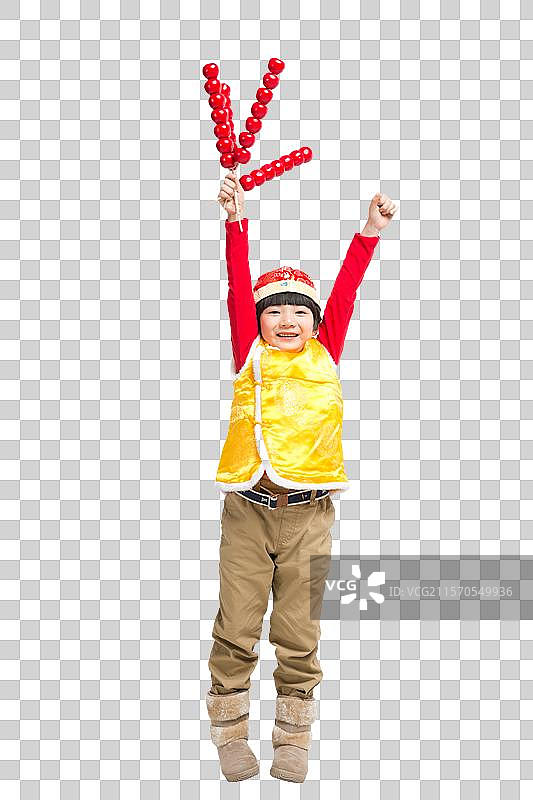 棚拍中国新年唐装儿童拿糖葫芦图片素材