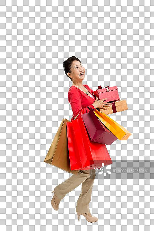 棚拍中老年女性提着购物袋图片素材