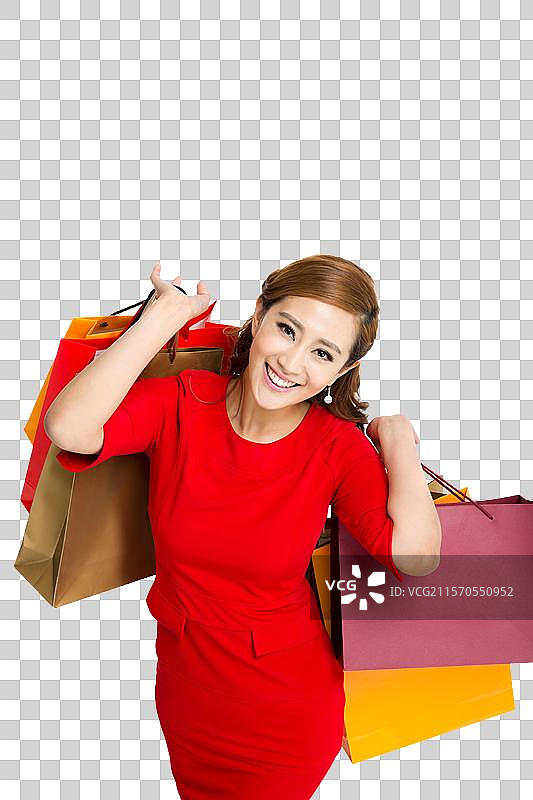 棚拍红裙子的年轻女人提着购物袋图片素材
