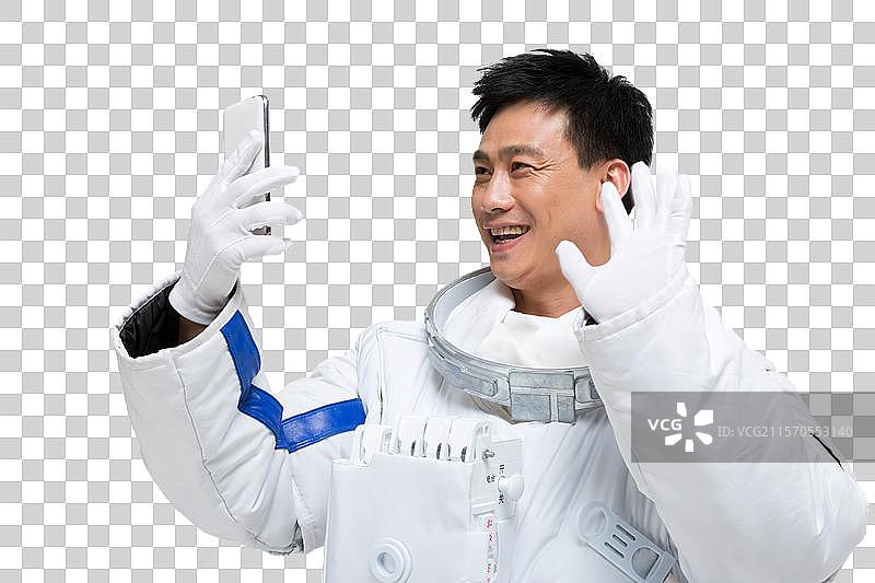 棚拍男宇航员展示手机图片素材
