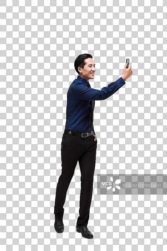 棚拍商务男士使用智能手机图片素材