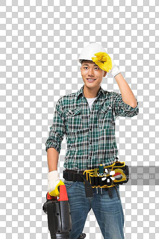 年轻的建筑工人拿冲击钻图片素材