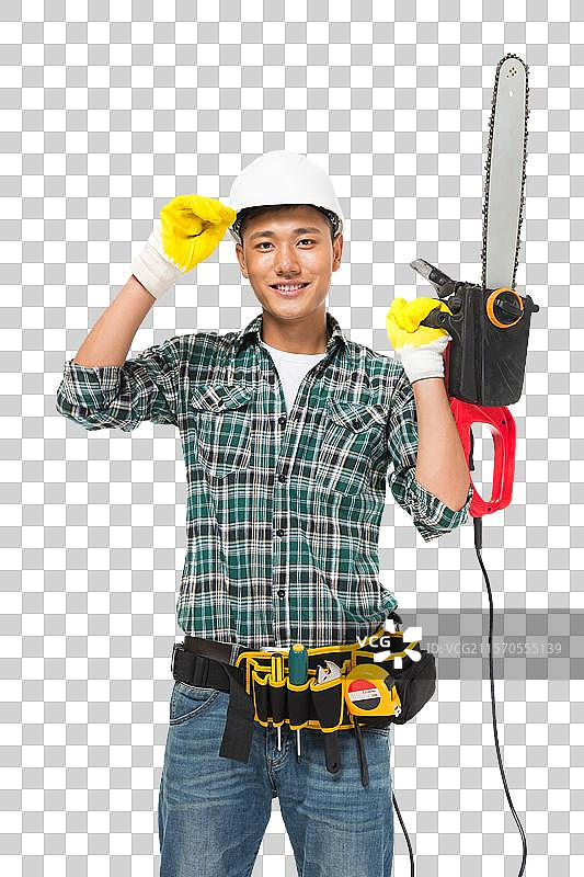 年轻的建筑工人拿电锯图片素材