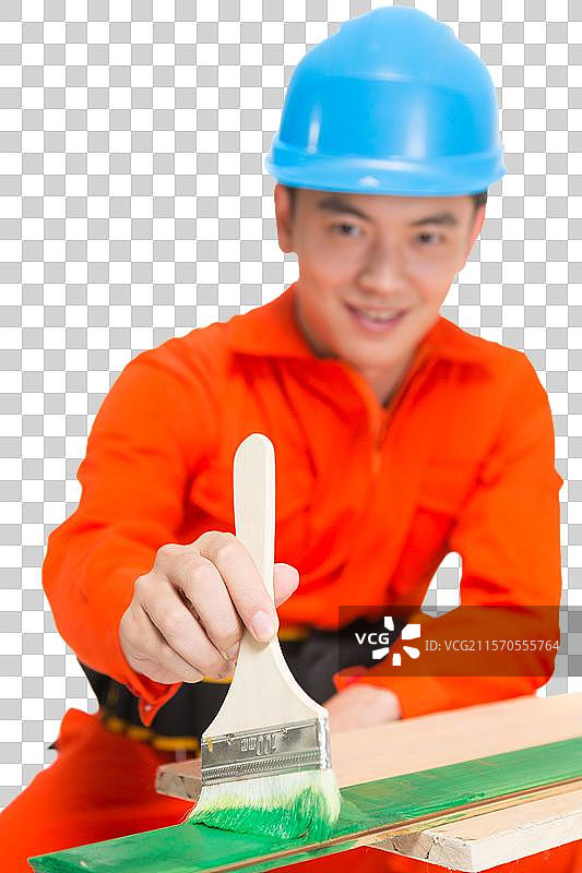 年轻的男建筑工人在刷漆图片素材