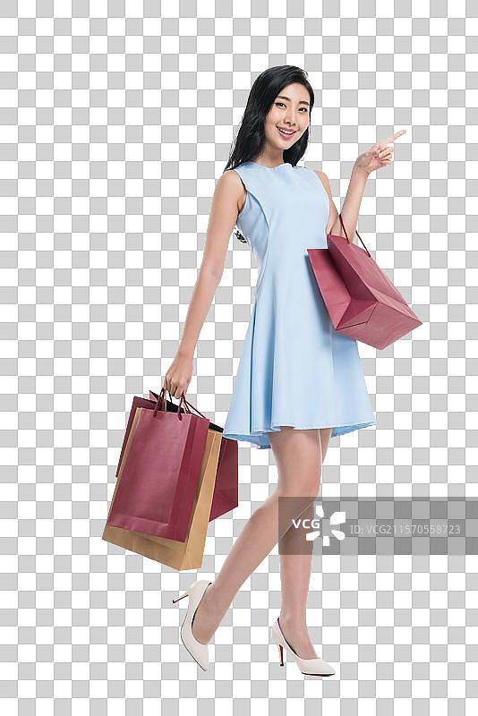 漂亮的年轻女人购物做手势图片素材