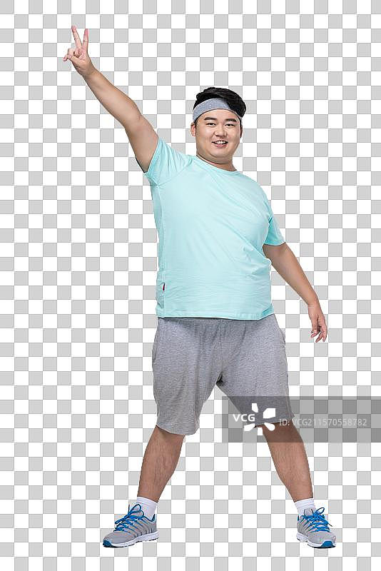 肥胖的青年男子在做运动图片素材