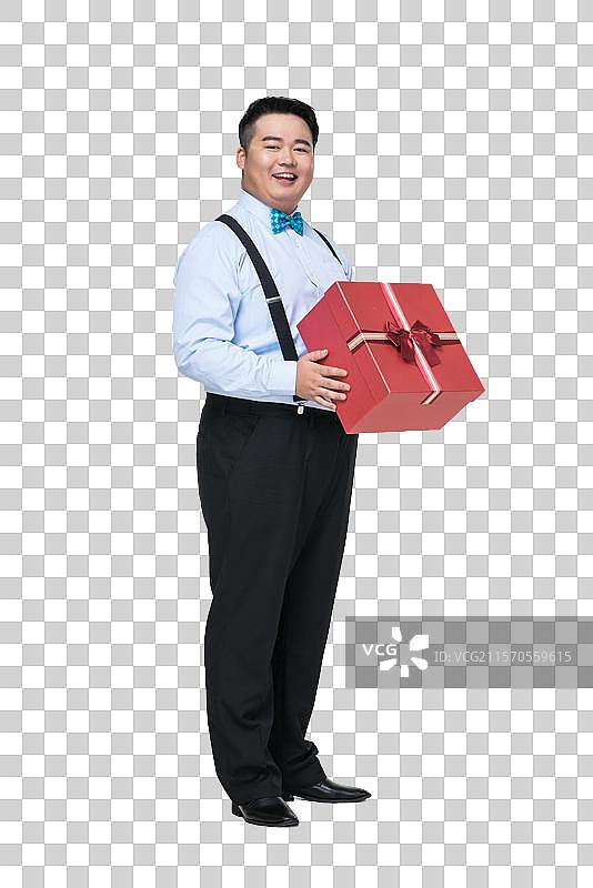 拿着礼盒的肥胖青年男子图片素材