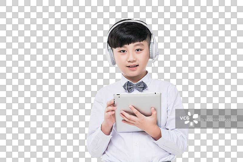 快乐的小学生使用平板电脑图片素材