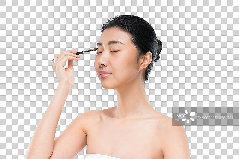 美女手拿化妆刷图片素材