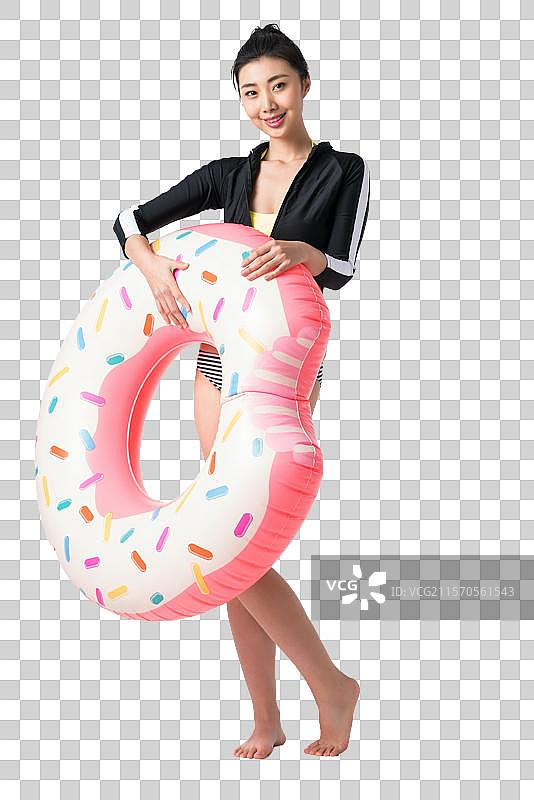 穿着比基尼的美女拿着游泳圈图片素材