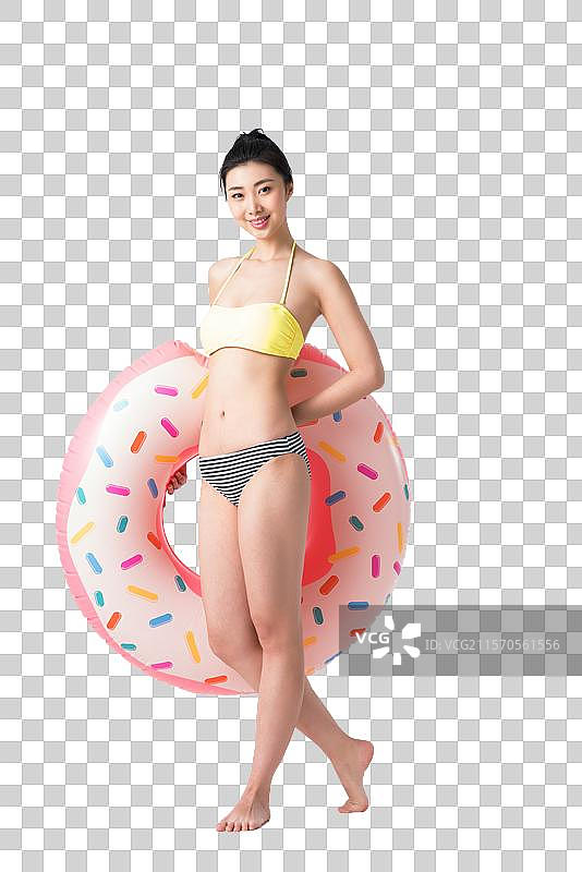 穿着比基尼的美女拿着游泳圈图片素材