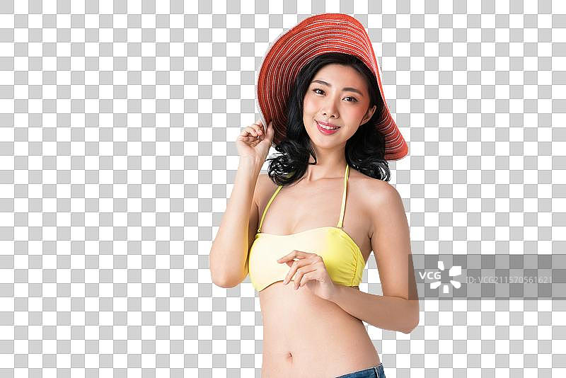 戴着遮阳帽穿着比基尼的美女图片素材