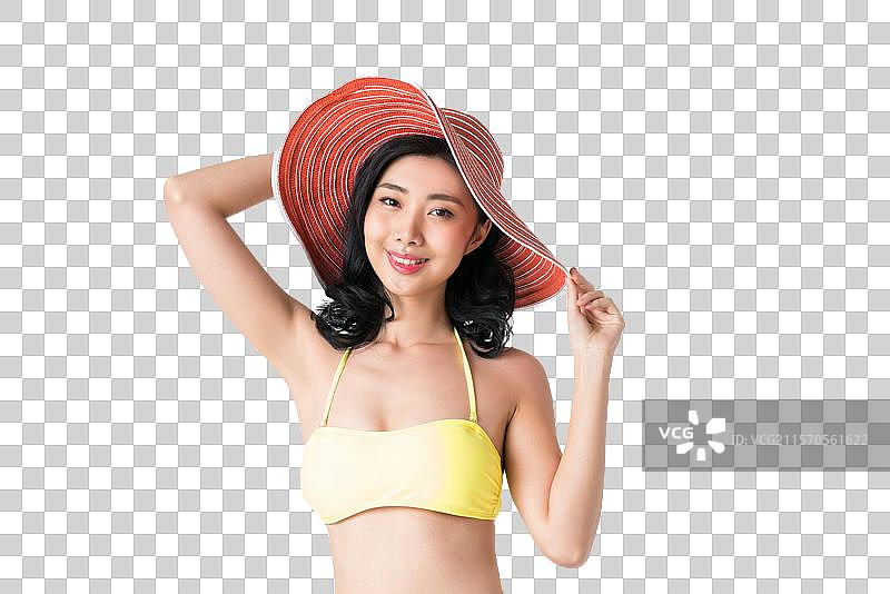 戴着遮阳帽穿着比基尼的美女图片素材