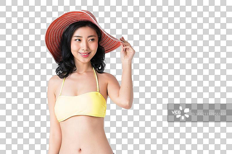 戴着遮阳帽穿着比基尼的美女图片素材