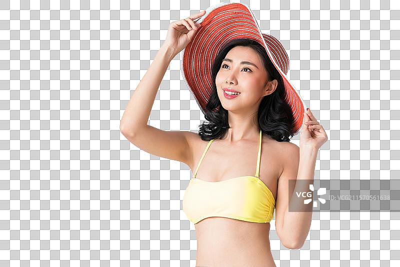 戴着遮阳帽穿着比基尼的美女图片素材