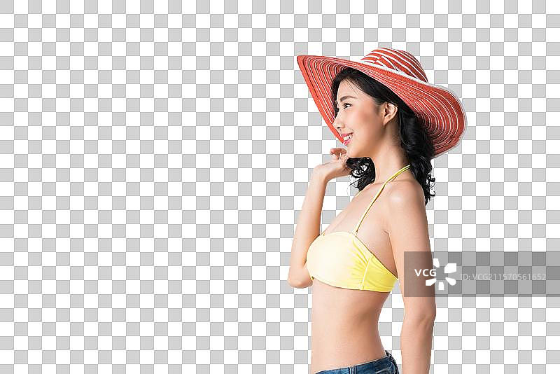 戴着遮阳帽穿着比基尼的美女图片素材
