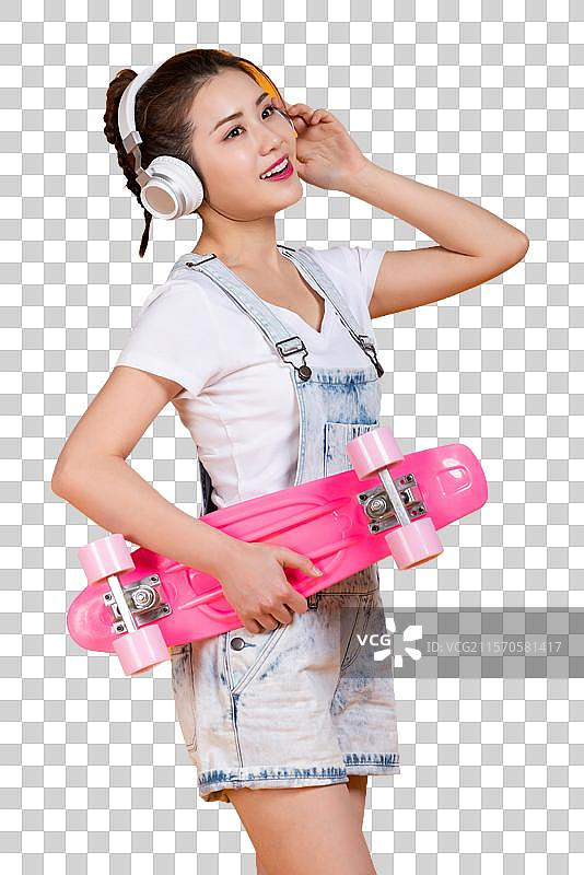棚拍拿着滑板的年轻女子图片素材