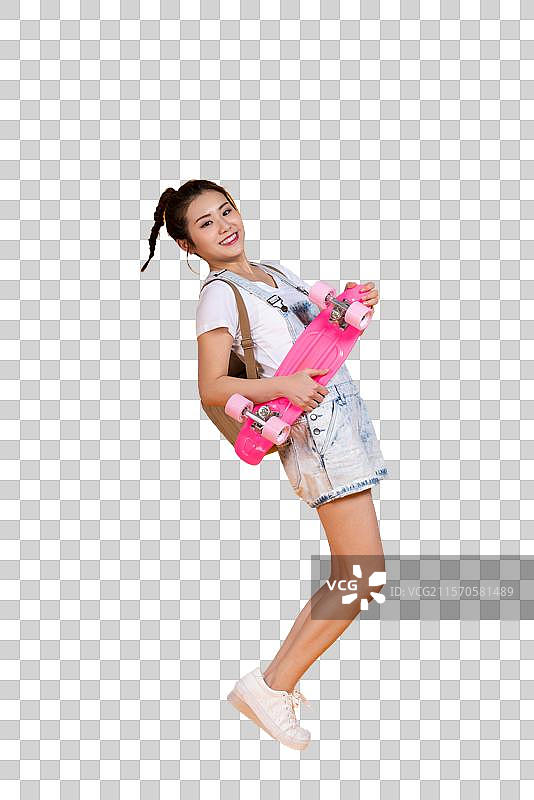 棚拍拿着滑板的年轻女子图片素材