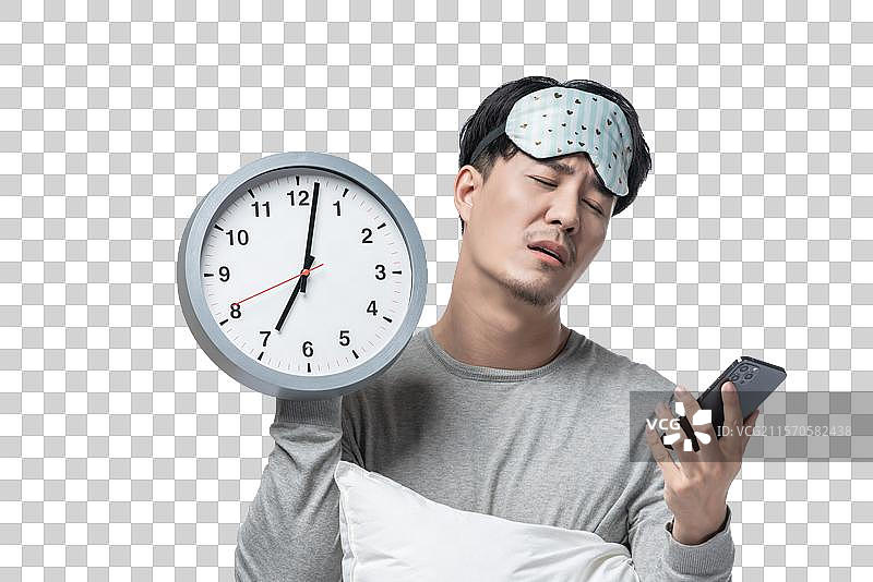 年轻男子拿着枕头图片素材