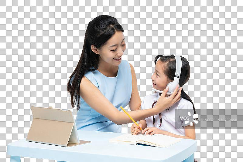 年轻女老师辅导学生学习图片素材