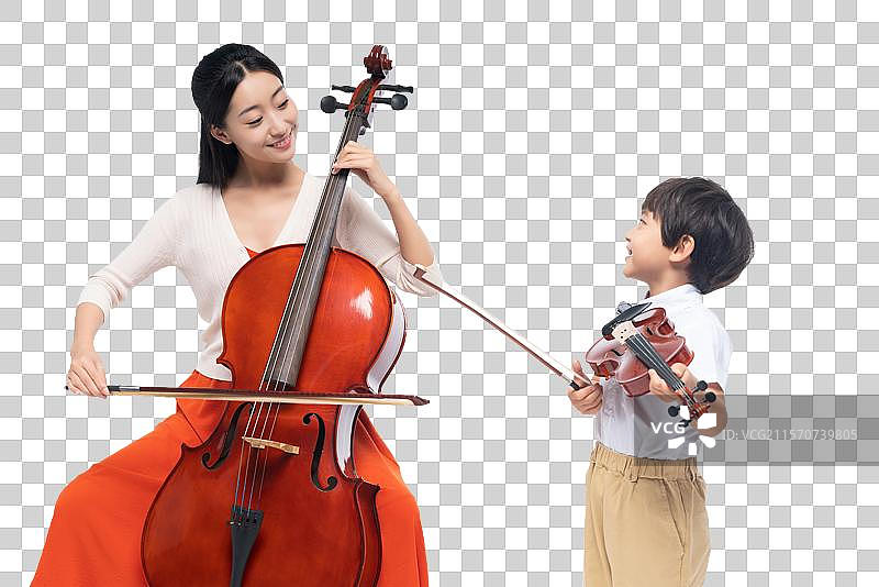 女老师指导男孩演奏乐器图片素材
