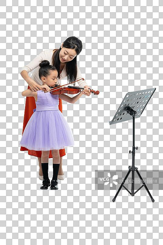 女老师指导女孩演奏乐器图片素材