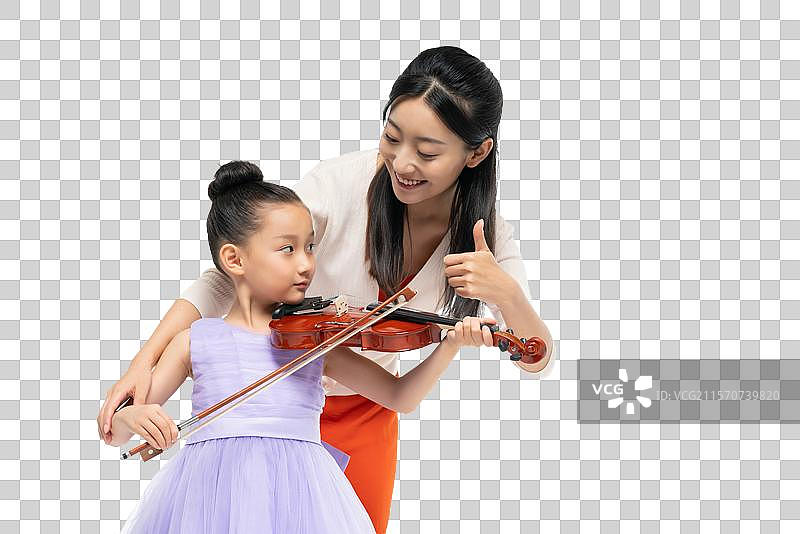 女老师指导女孩演奏乐器图片素材