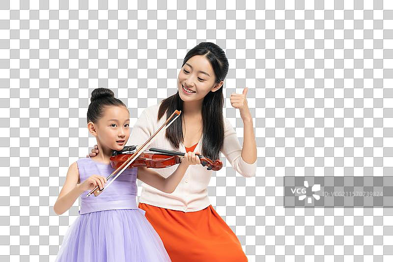 女老师指导女孩演奏乐器图片素材