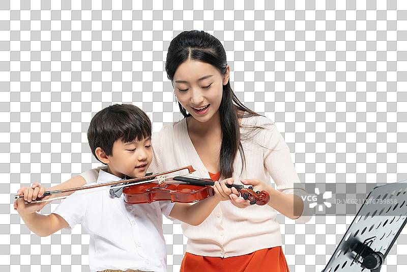 女老师指导男孩演奏乐器图片素材