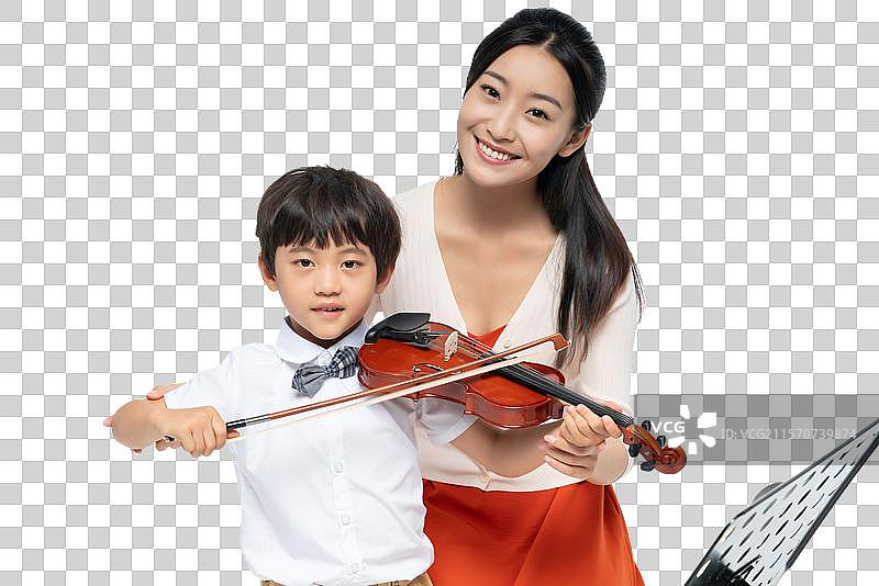 女老师指导男孩演奏乐器图片素材
