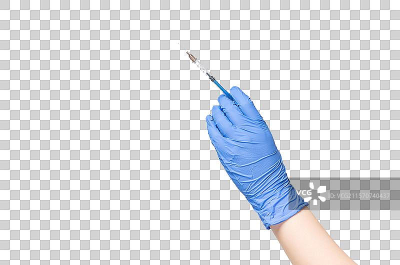 拿着注射器的手图片素材