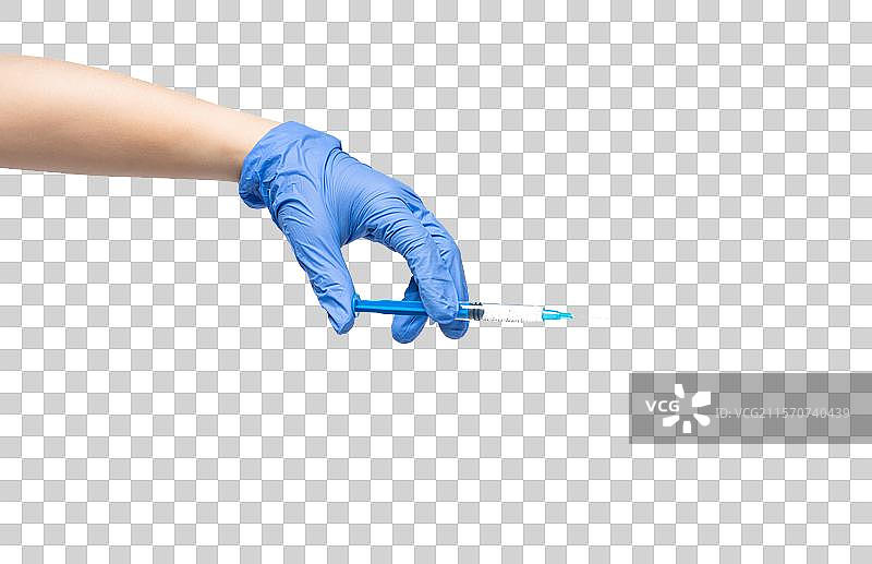拿着注射器的手图片素材