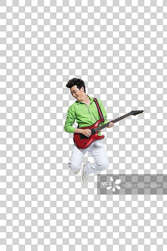 棚拍时尚活力年轻人弹吉他跳跃图片素材