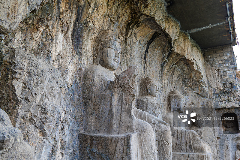 河南洛阳龙门石窟摩崖三佛龛图片素材