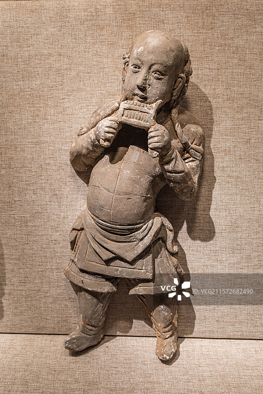 吹排箫雕砖俑，元代，焦作市西冯封村出土，河南博物院图片素材