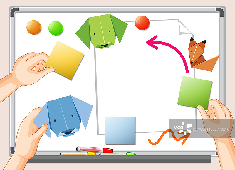 手在白板上摆放五彩斑斓的折纸图片素材