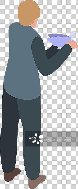 志愿者手中捧着一只白鸽，象征着图片素材