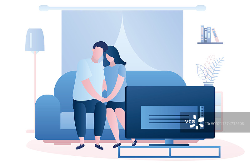 一对情侣坐在沙发上看电视图片素材