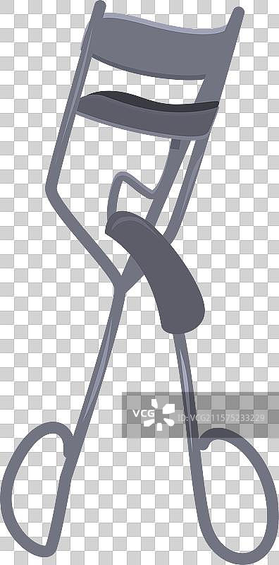 金属睫毛夹立在白色背景上图片素材