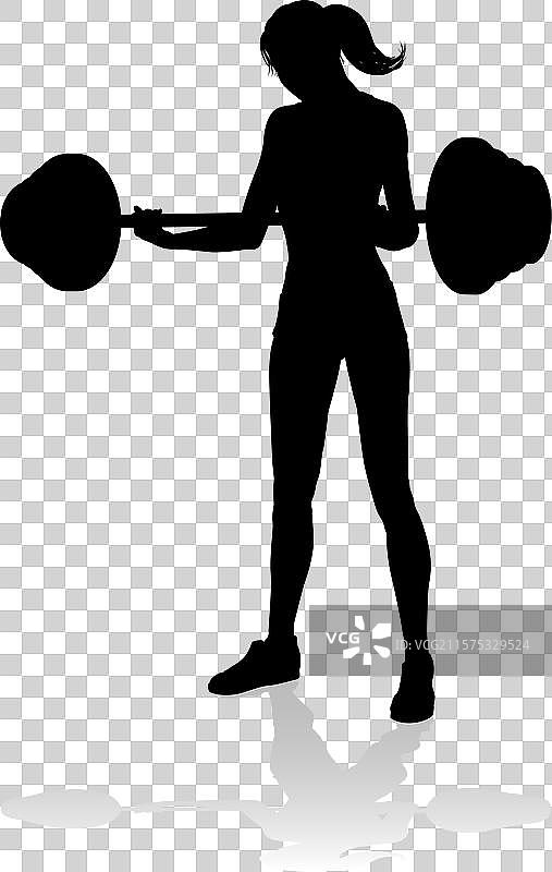 健身房女性剪影与杠铃重量图片素材