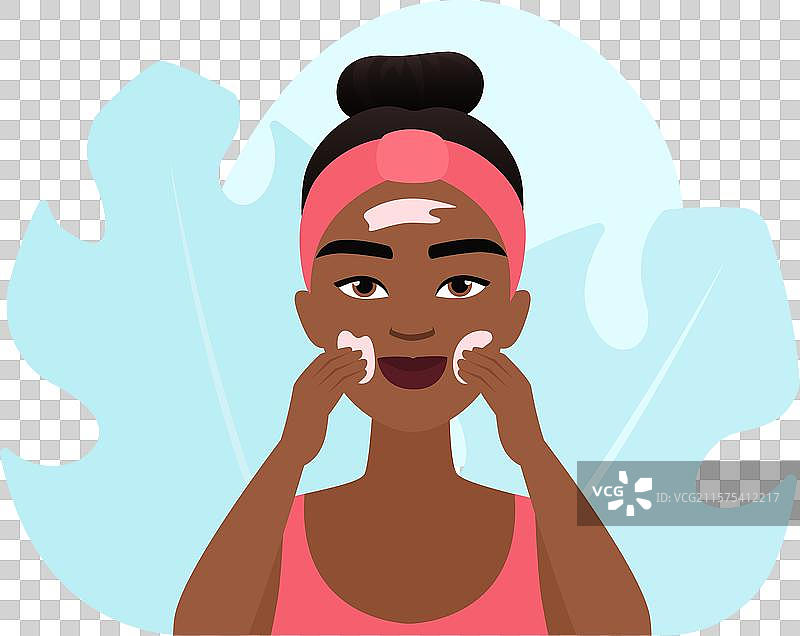 女孩在脸上涂抹化妆品霜图片素材