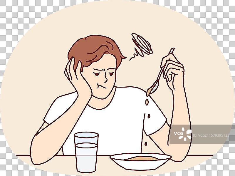 男子坐在桌旁，因食欲不振而苦恼。图片素材